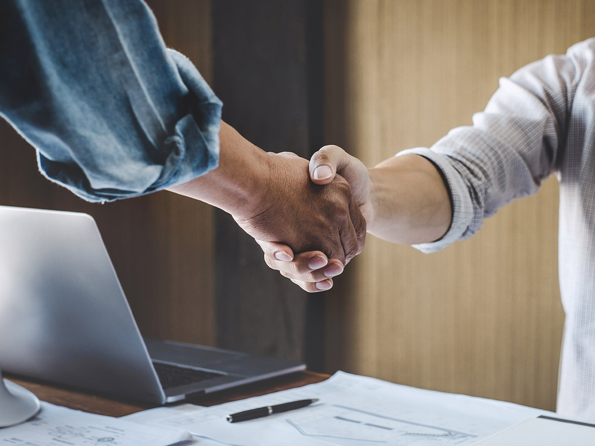 Two partners shaking hands.