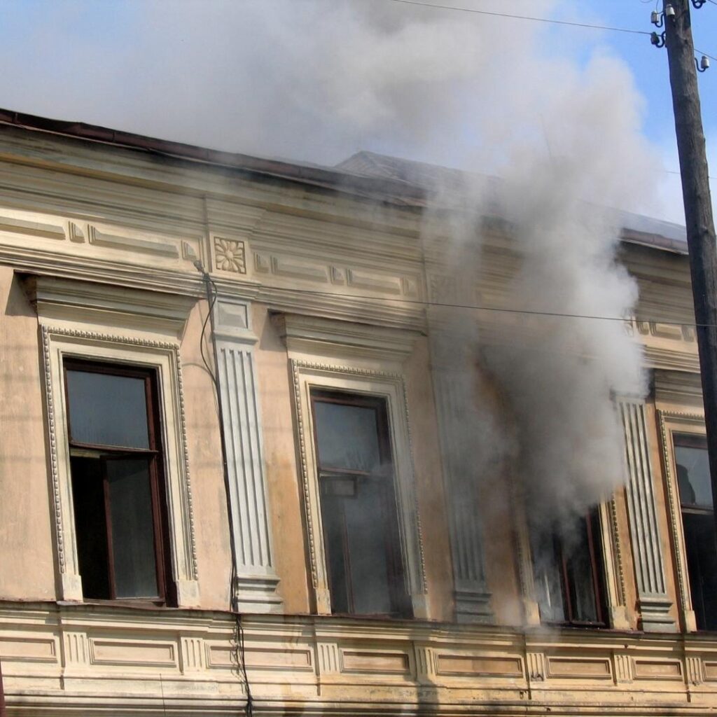 Antique building, smoke in the window